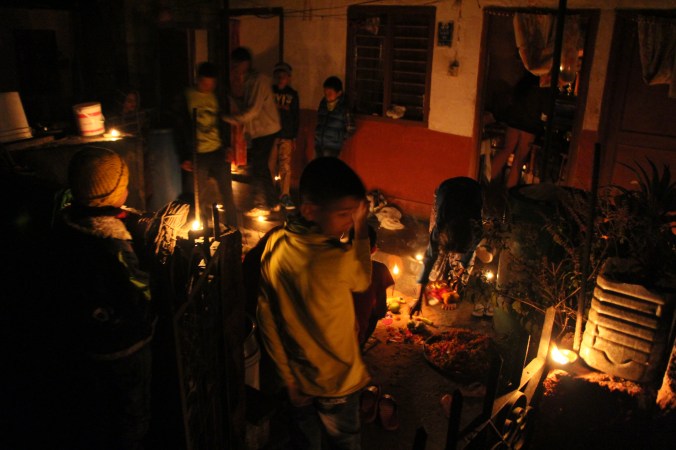 A family celebrates Tihar, the festival of lights, Pokhara lakeside, Nepal. Image Copyright Neesha (Alexandra) Bremner 2013.