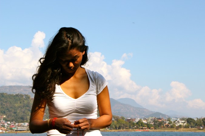 Yoga teacher and healer Devika Gurung of Himilayan Yogini moves through her Asana practice during a break in filming with  The Storyteller Project in January 2013.